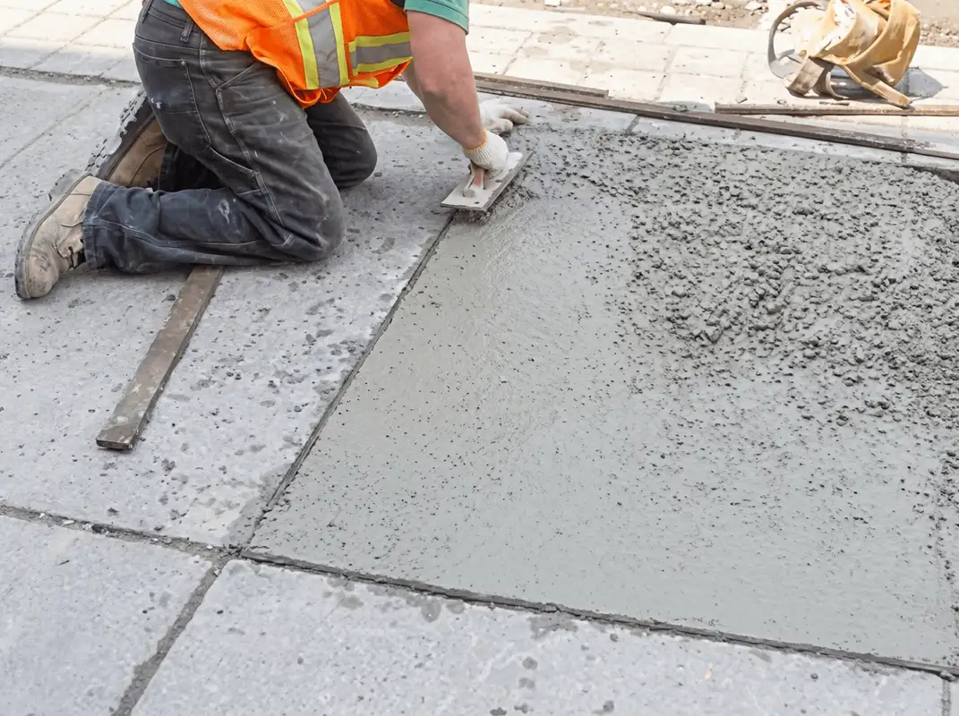 Professional repairing a concrete floor in Charlotte, NC