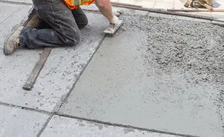 Professional repairing a concrete floor in Charlotte, NC